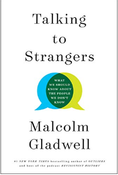 Book cover of Talking to Strangers by Malcolm Gladwell in simple white with black text. Blue and yellow conversation bubbles overlap in the middle.