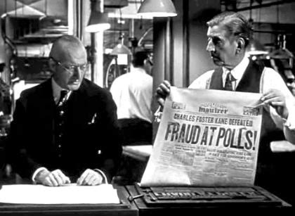 Screen shot of Citizen Kane in which one person holds up a newspaper mock-up for another. The headline reads: FRAUD AT POLLS!