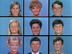 The 9-way split screen with characters of the Brady Bunch in each, from the opening segment