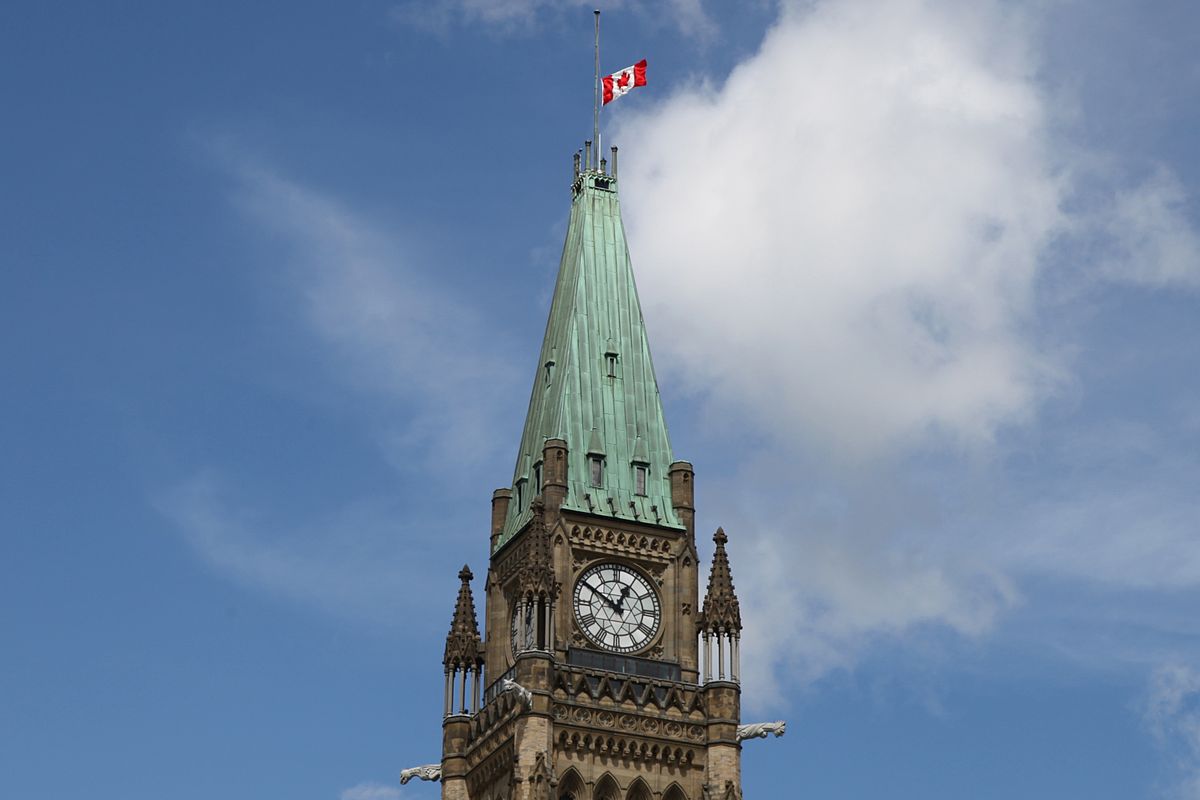 Canadian flag at half mast on the peace tower in ottawa