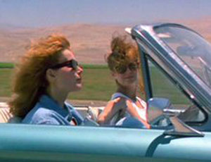 Still from Thelma and Louise as they are driving in the convertible. 