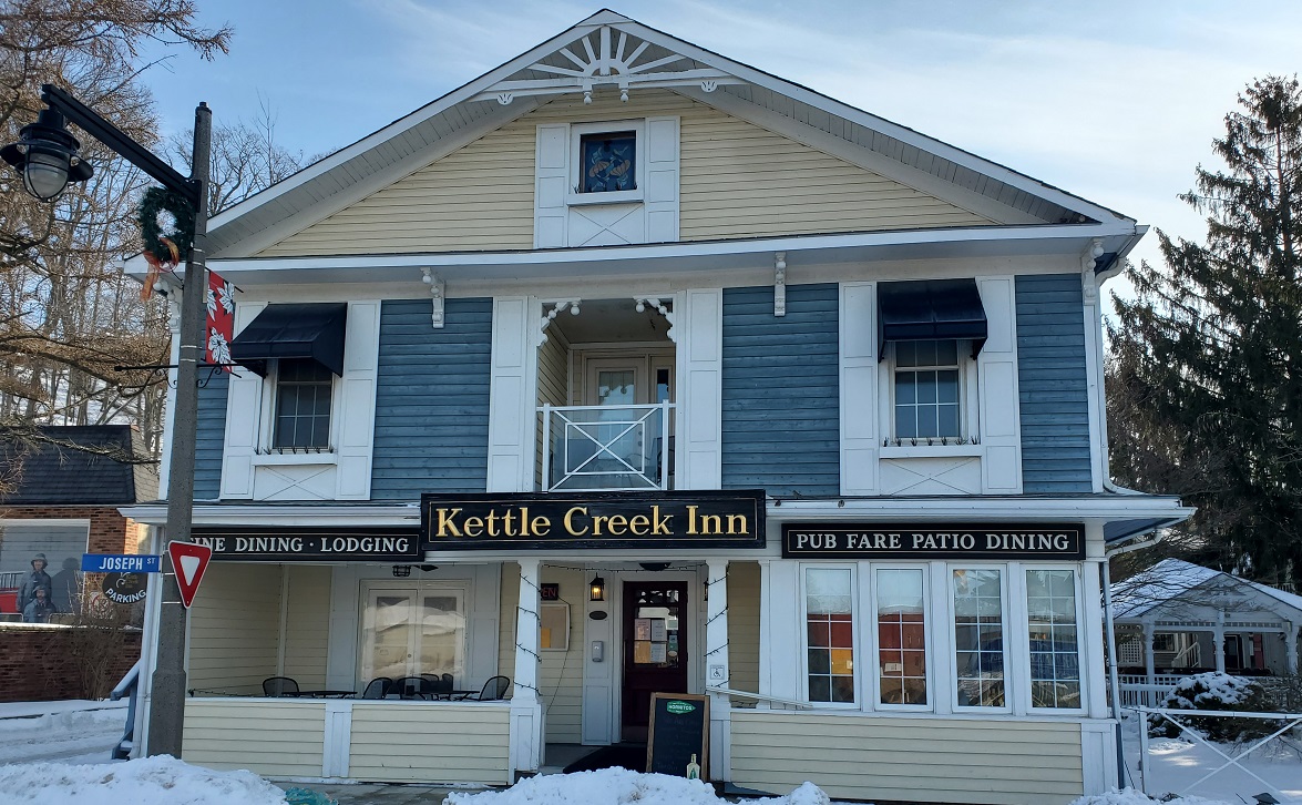 The Kettle Creek Inn, a well-kept blue home with white trim. 