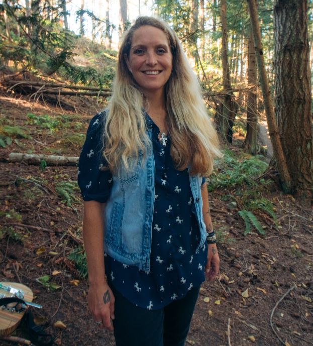 Sarah Smith standing outside, wearing denim, and smiling