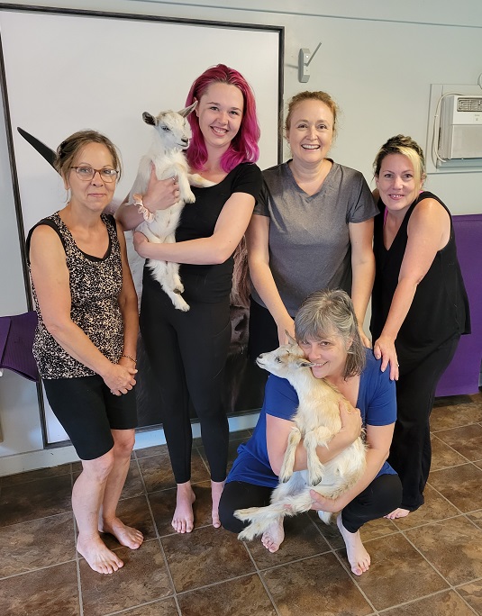 Our group of five posing with two baby goats.
