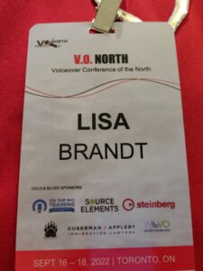 lanyard for VO North showing my name and all of the sponsors