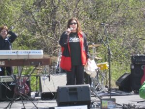 Me wearing 680 News gear emceeing an outdoor event - the David Bloom memorial walk for brain tumour research.