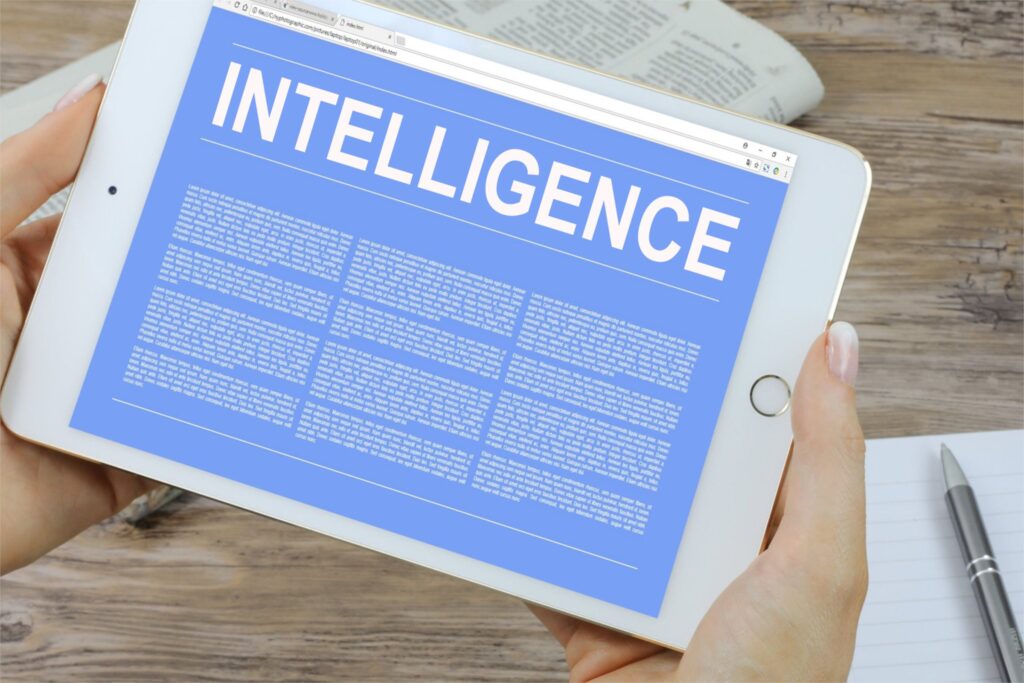 tablet with the word Intelligence across the top and text that we can't read