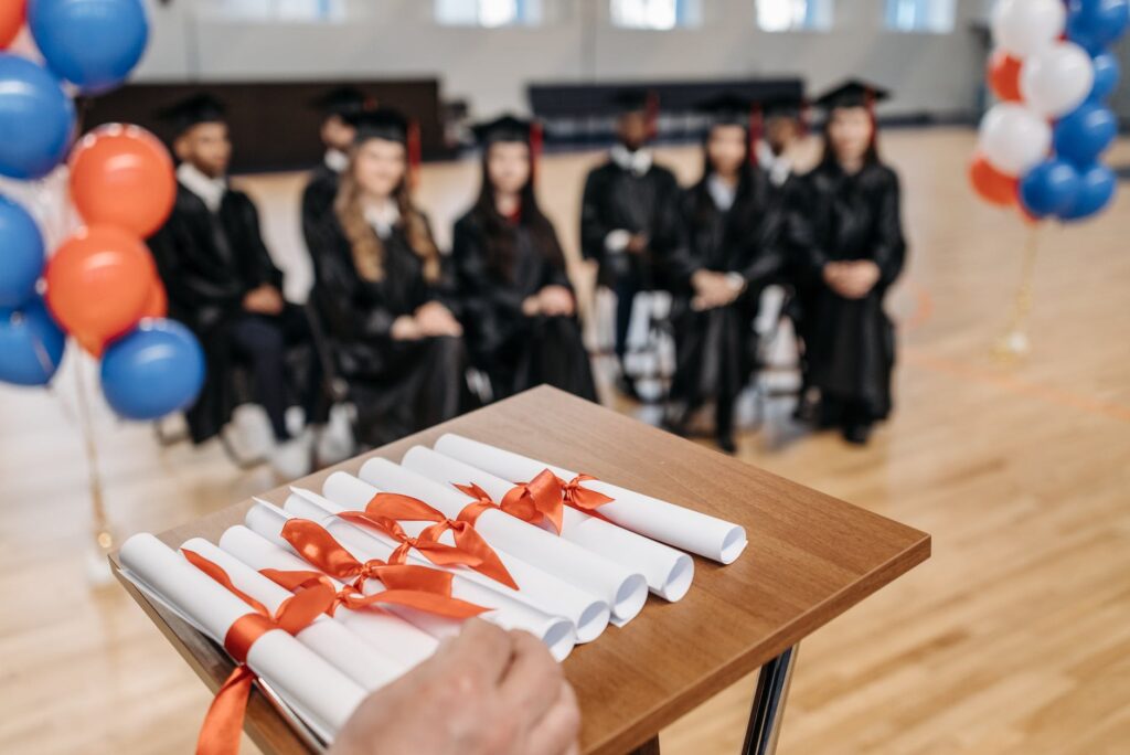 photo of diploma on top of speech desk