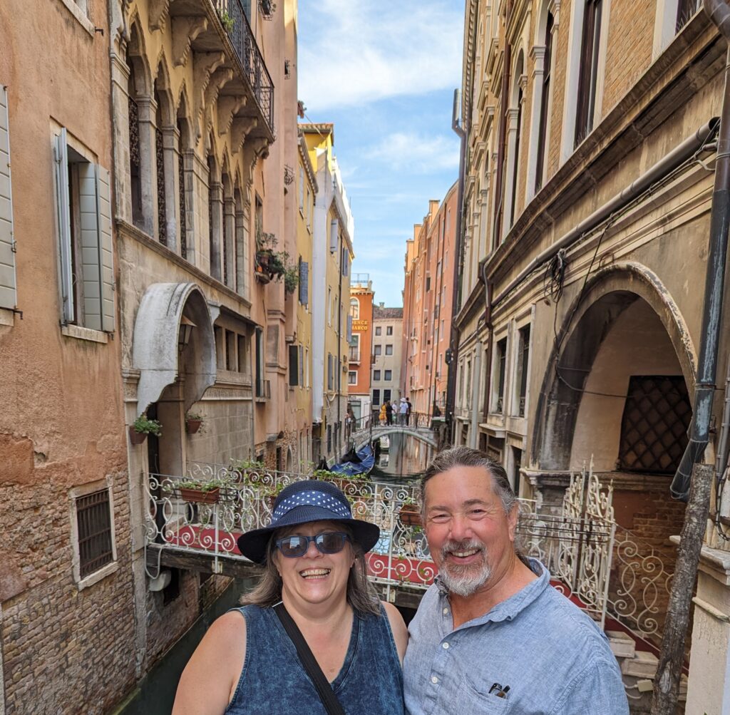 Derek and I smiling in front of one of Venice's many canals.