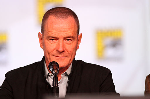 Bryan Cranston in front of a microphone at a TV industry convention