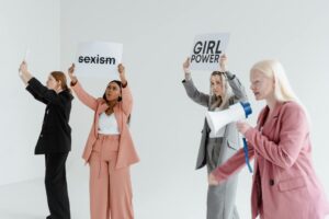 a group of women protesting while holding placards
