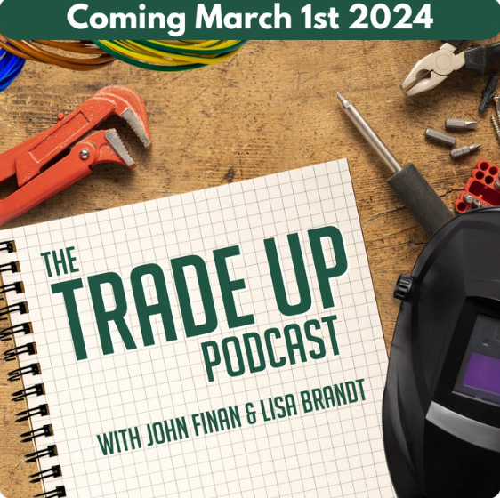 Podcast launch artwork features a piece of graph paper with the title The Trade Up Podcast with John Finan and Lisa Brandt on a workbench with various tools and a welding helmet nearby