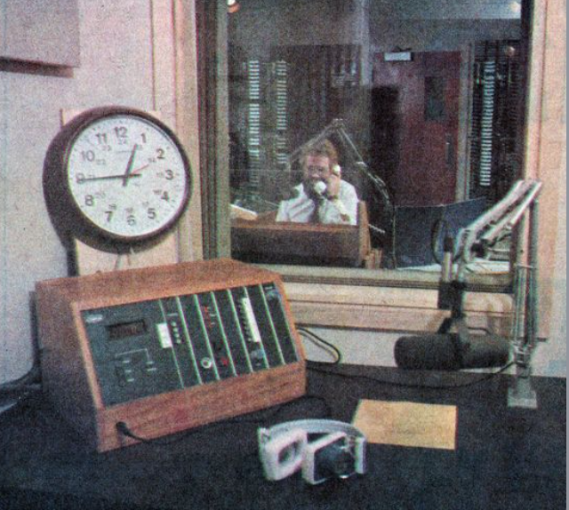 Dick Joseph in the CKSL 1410 control room as seen through the guest booth.