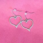 Heart earrings on a pink background
