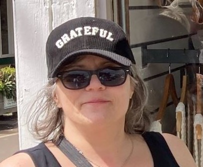 Me in Hawaii wearing sunglasses and a ball cap that has the word GRATEFUL embroidered on it