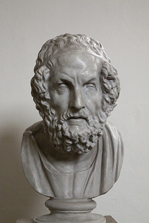 A bust of Homer, looking all wise with curly hair and a curly beard