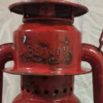 Beacon logo on red railroad lantern