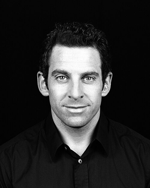 Portrait of Sam Harris, a white man with dark hair in his 50s.
