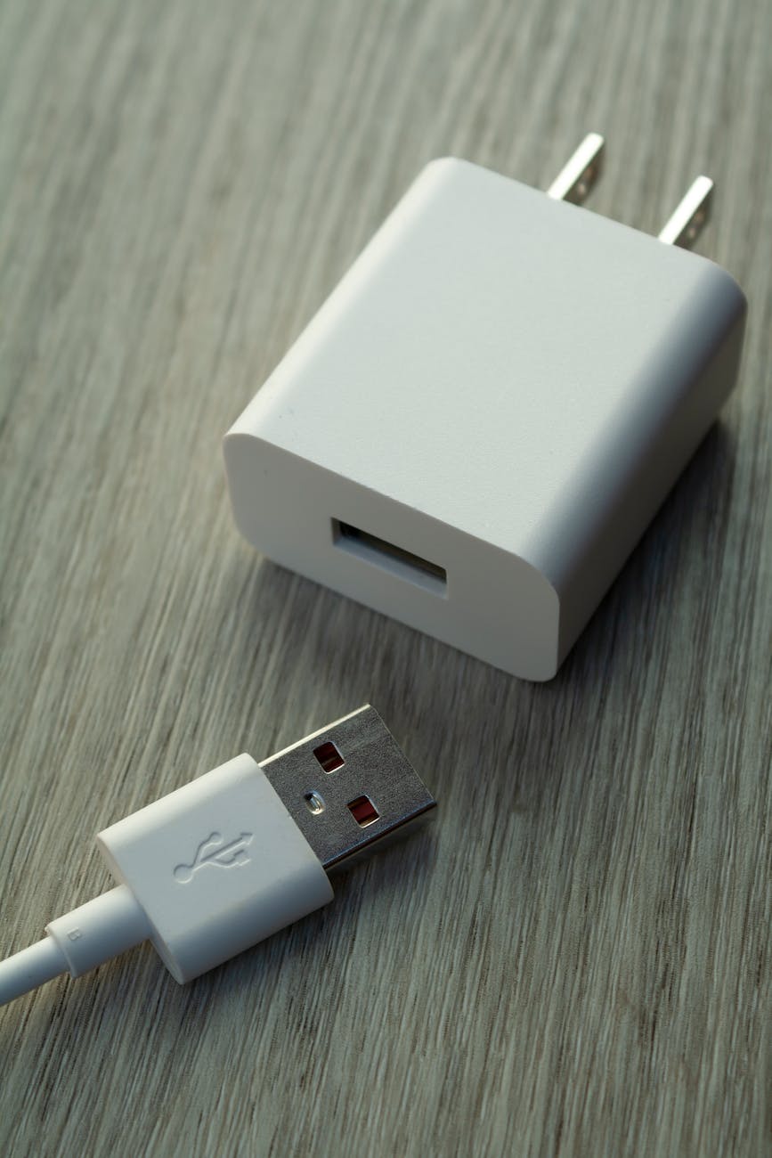 close up of white usb charger and cable