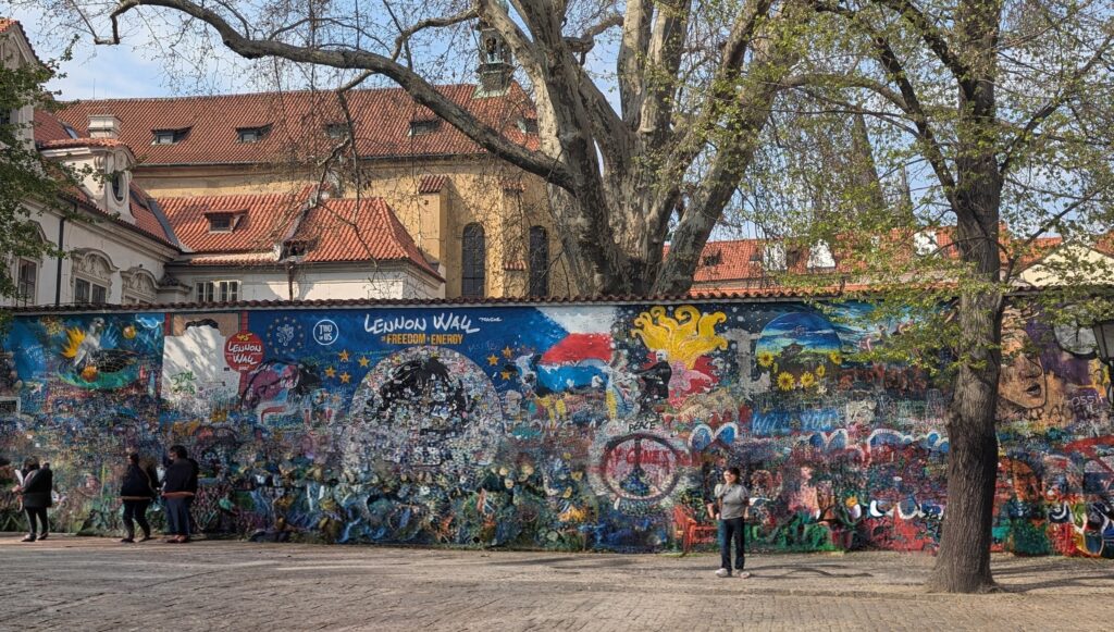 The colourful, graffiti wall inspired by John Lennon and peace. Covered over hundreds of times by the authorities, it prevailed and became a symbol of a new era.