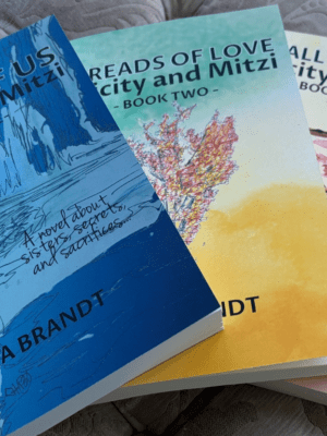 covers fanned out of all 3 books in the Felicity and Mitzi series