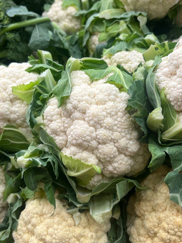 fresh organic cauliflower close up in market