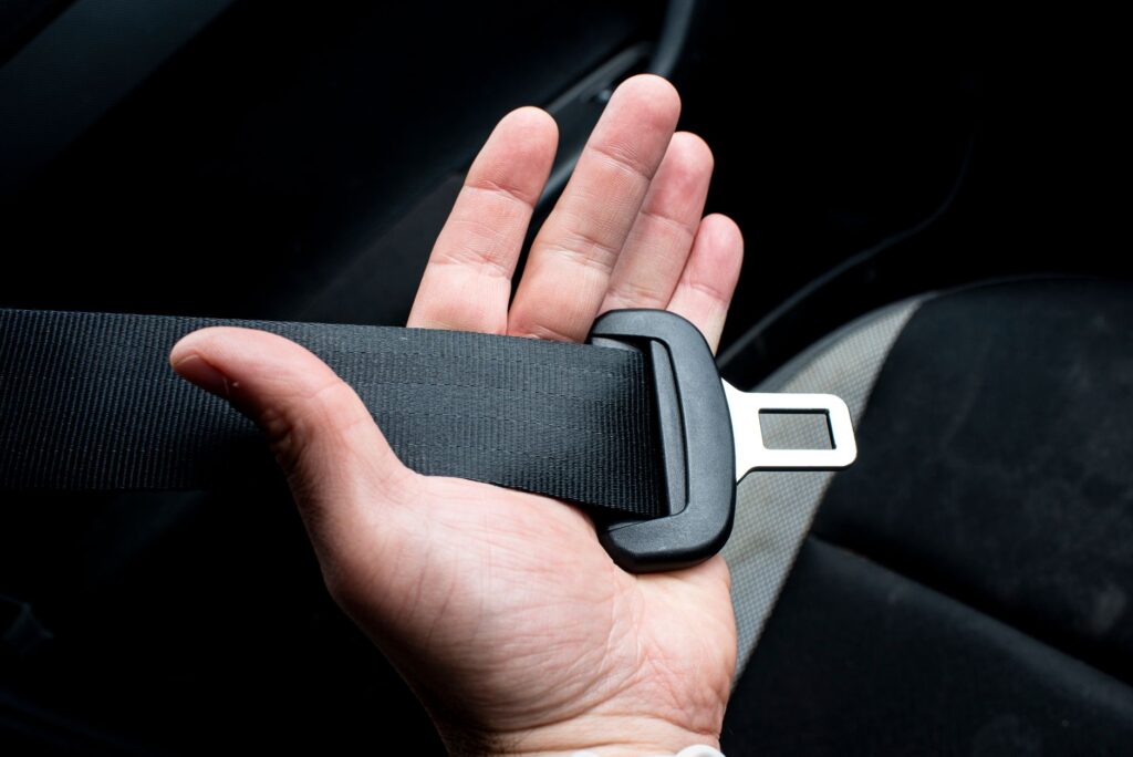 hand holding seat belt