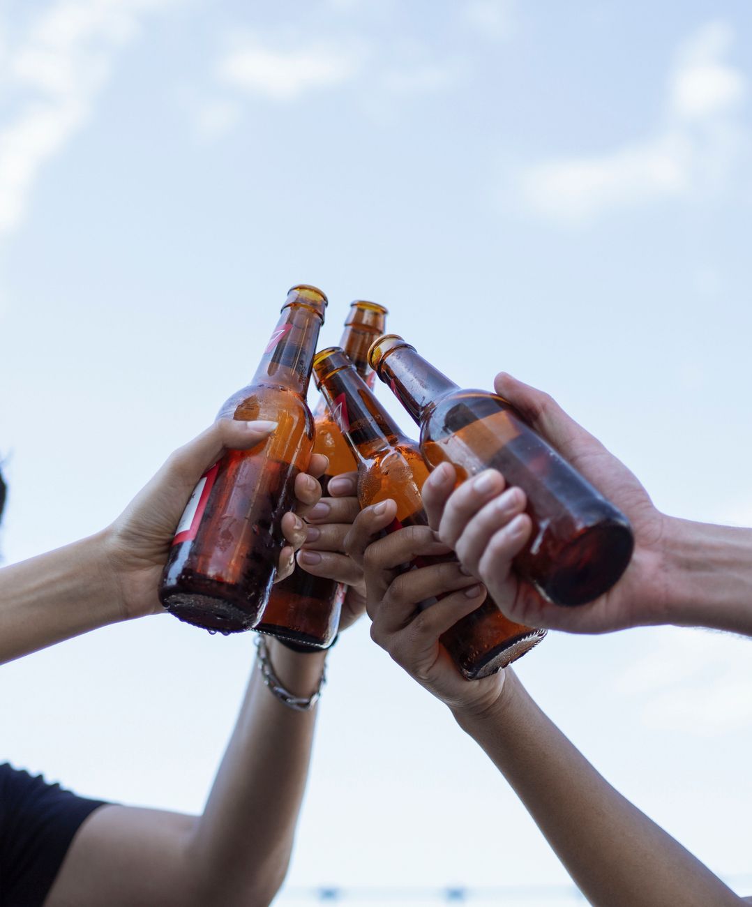 close up of bottles in hands